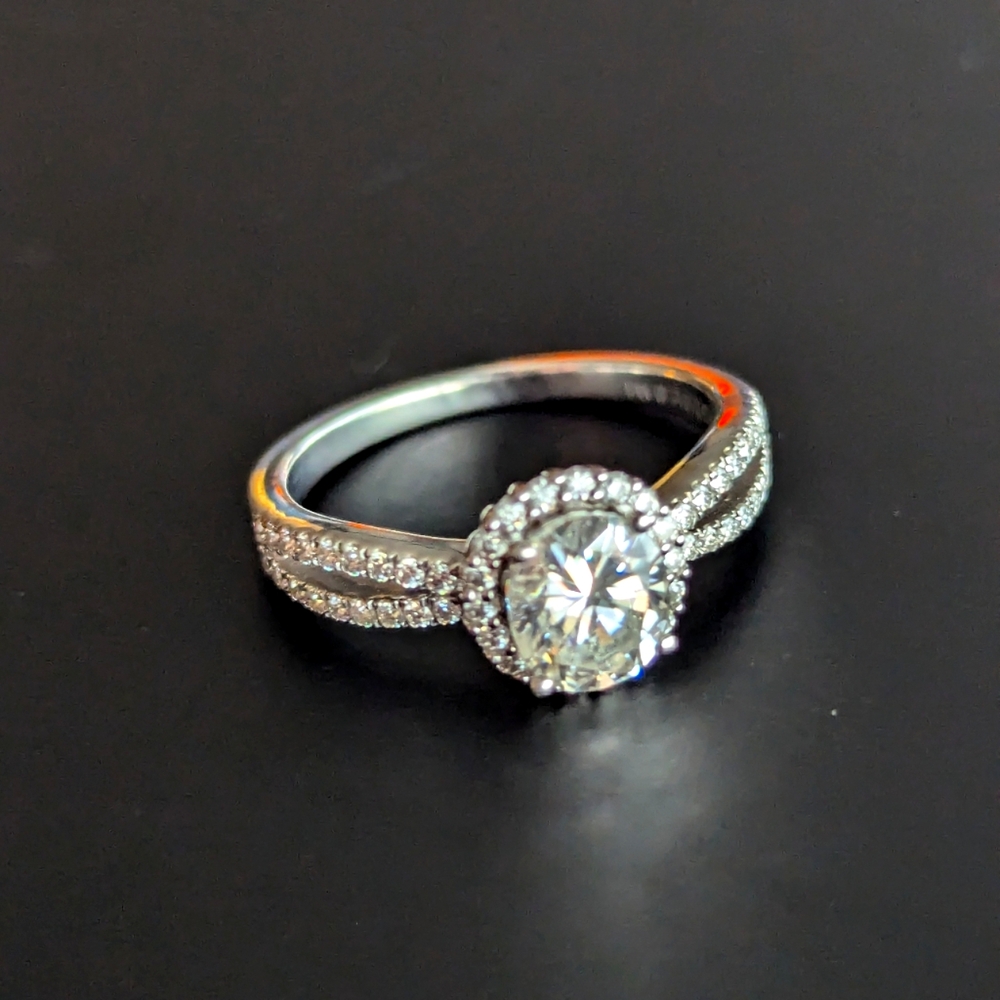 Moissanite and sterling silver engagement style ring.